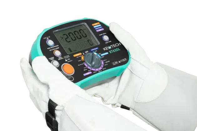Electrician testing with the KT63DL wearing electrical gloves