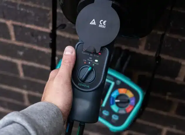 Electrician testing an EV charge point with the KEWEVA
